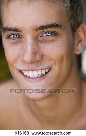Close-up of man smiling View Large Photo Image Stock Photo - Close-up of man smiling. Fotosearch