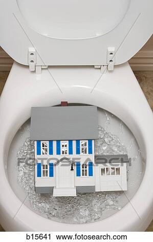 Close-up of toilet with toy house View Large Photo Image Stock Image - Close-up of toilet with toy house. Fotosearch