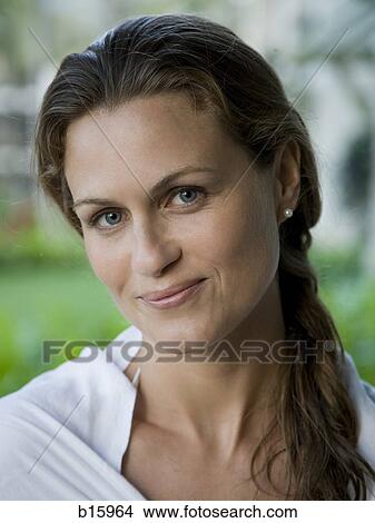 Picture - Close-up of woman outdoors smiling. Fotosearch