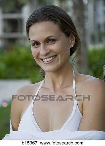 Stock Photo - Close-up of woman outdoors smiling. Fotosearch