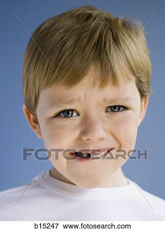 Closeup of boy biting lip View Large Photo Image Stock Photo - Closeup of boy biting lip. Fotosearch