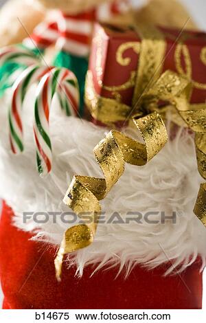 Closeup of Christmas stocking with candy canes and ribbon View Large Photo Image Stock Photography - Closeup of Christmas stocking with candy canes and ribbon. Fotosearch