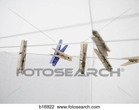Closeup of clothes pegs on a clothesline View Large Photo Image Stock Image - Closeup of clothes pegs on a clothesline. Fotosearch