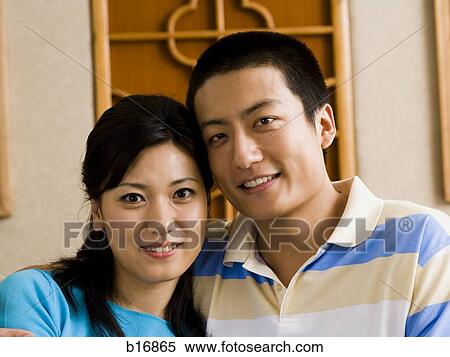 Stock Photography - Closeup of couple embracing and smiling. Fotosearch
