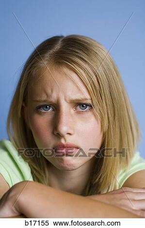 Stock Photography - Closeup of girl looking unhappy. Fotosearch