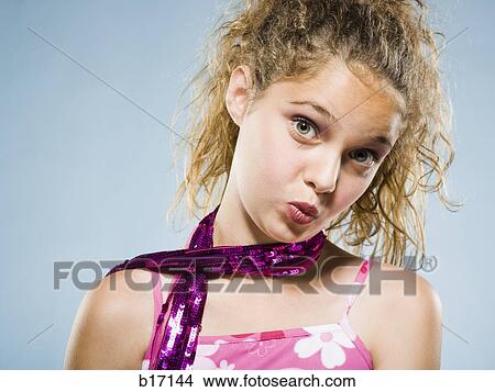 Closeup of girl with lipstick puckering lips View Large Photo Image Picture - Closeup of girl with lipstick puckering lips. Fotosearch