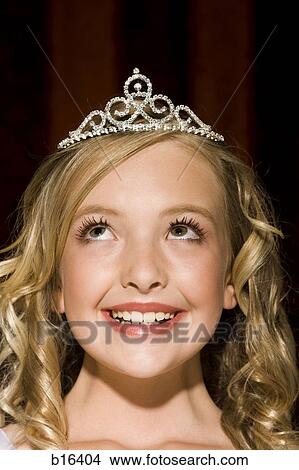 Closeup of girl with tiara looking up smiling View Large Photo Image Picture - Closeup of girl with tiara looking up smiling. Fotosearch