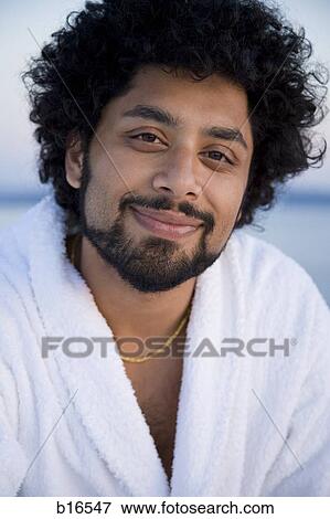 Closeup of man with beard in bathrobe outdoors smiling View Large Photo Image Stock Photo - Closeup of man with beard in bathrobe outdoors smiling. Fotosearch