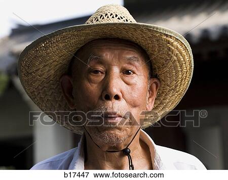 Closeup of mature man with straw hat View Large Photo Image Stock Photo - Closeup of mature man with straw hat. Fotosearch