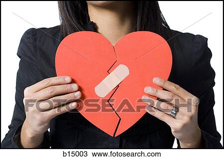 Stock Image - Closeup of mended red heart. Fotosearch