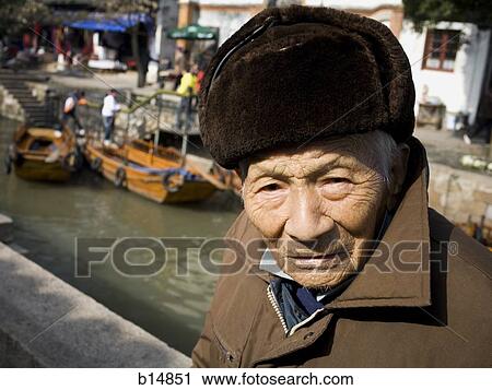 Stock Image - Closeup of old man with hat outdoors. Fotosearch