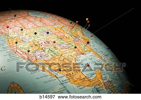 Closeup of pushpins in globe View Large Photo Image Stock Photo - Closeup of pushpins in globe. Fotosearch