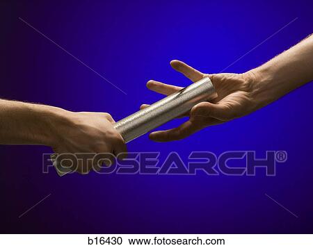 Stock Image - Closeup of relay baton being passed. Fotosearch