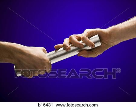 Stock Image - Closeup of relay baton being passed. Fotosearch