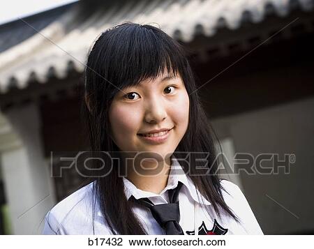 Closeup of teenage girl in school uniform smiling View Large Photo Image Stock Image - Closeup of teenage girl in school uniform smiling. Fotosearch