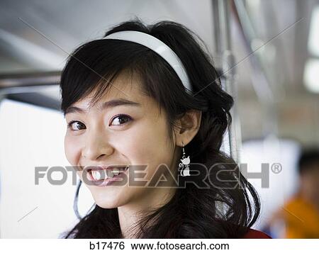 Stock Photograph - Closeup of teenage girl smiling. Fotosearch