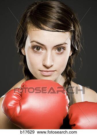 Stock Photo - Closeup of teenage girl with boxing gloves. Fotosearch