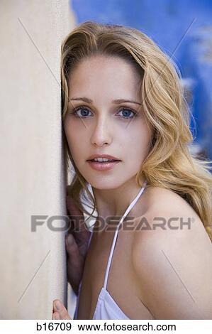 Closeup of woman leaning on wall View Large Photo Image Stock Photo - Closeup of woman leaning on wall. Fotosearch