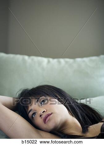 Stock Image - Closeup of woman lying down. Fotosearch