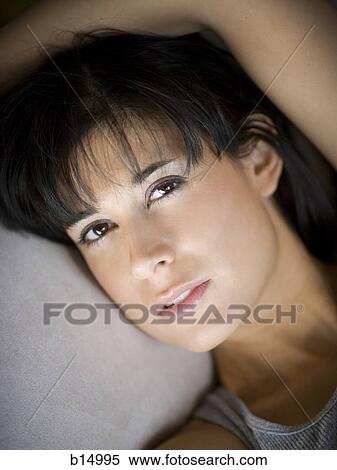Closeup of woman lying down View Large Photo Image Stock Photography - Closeup of woman lying down. Fotosearch