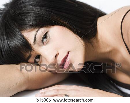 Stock Photography - Closeup of woman lying down. Fotosearch
