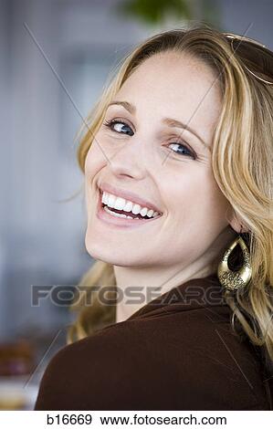 Stock Photo - Closeup of woman smiling outdoors. Fotosearch