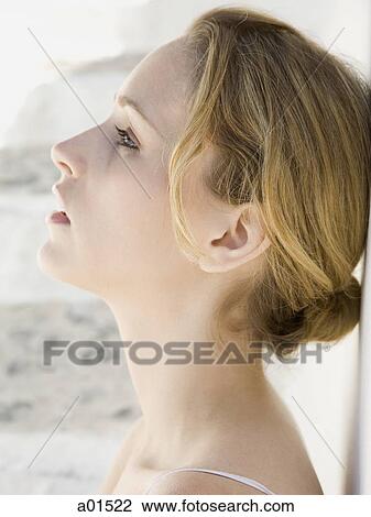 Closeup profile of woman leaning on wall View Large Photo Image Stock Image - Closeup profile of woman leaning on wall. Fotosearch