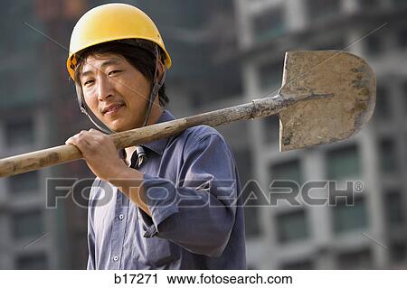 Construction worker outdoors with helmet smiling View Large Photo Image Stock Image - Construction worker outdoors with helmet smiling. Fotosearch