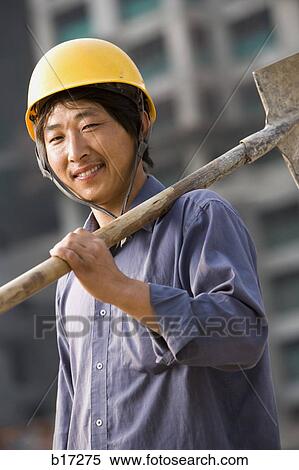 Construction worker outdoors with helmet smiling View Large Photo Image Stock Photography - Construction worker outdoors with helmet smiling. Fotosearch