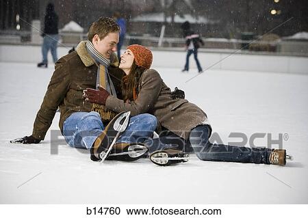 Couple falling while ice skating View Large Photo Image Stock Image - Couple falling while ice skating. Fotosearch