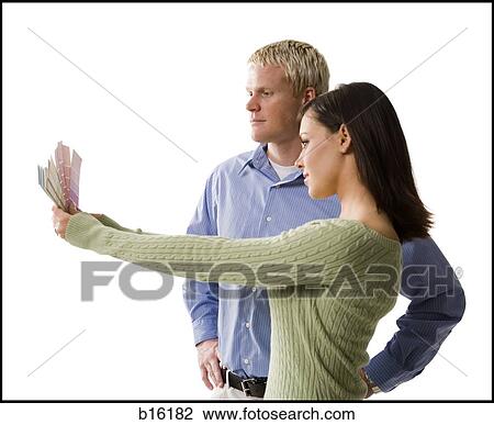 Couple looking at paint chips View Large Photo Image Stock Image - Couple looking at paint chips. Fotosearch