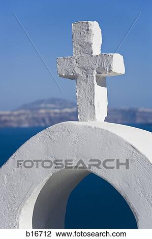 Cross on arch with water and blue sky View Large Photo Image Stock Image - Cross on arch with water and blue sky. Fotosearch