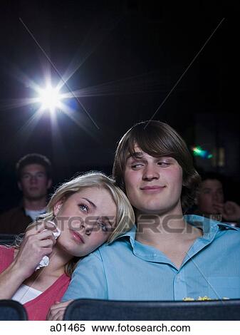 Crying girl and smiling boy watching movie at theater View Large Photo Image Stock Photography - Crying girl and smiling boy watching movie at theater. Fotosearch