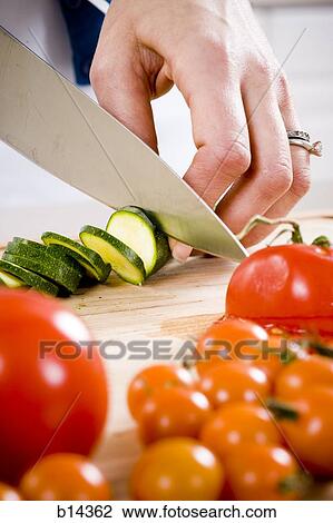 Stock Image - cutting vegtables. Fotosearch