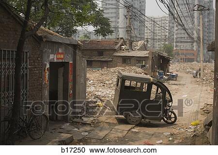 Stock Image - Detail of city street with garbage and urban blight. Fotosearch