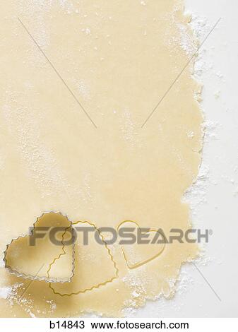 Detailed view of dough with heart cookie cutter View Large Photo Image Stock Image - Detailed view of dough with heart cookie cutter. Fotosearch