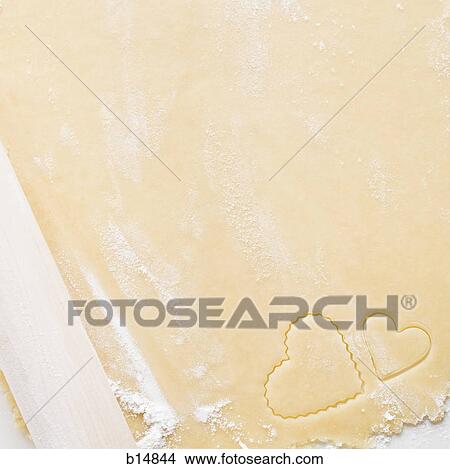 Detailed view of dough with hearts and rolling pin View Large Photo Image Picture - Detailed view of dough with hearts and rolling pin. Fotosearch