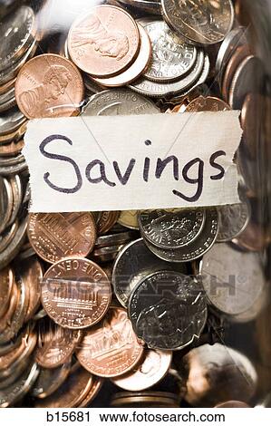Detailed view of glass jar with coins and Savings label View Large Photo Image Stock Image - Detailed view of glass jar with coins and Savings label. Fotosearch