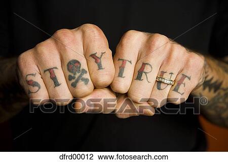 Detailed view of hands with Stay True on fingers and wedding band View Large Photo Image Stock Image - Detailed view of hands with Stay True on fingers and wedding band. Fotosearch