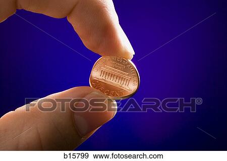 Detailed view of male hand bending penny View Large Photo Image Stock Photo - Detailed view of male hand bending penny. Fotosearch