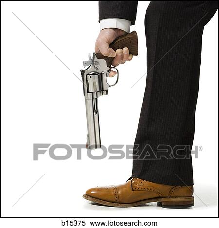 Detailed view of man pointing shotgun at foot View Large Photo Image Stock Photography - Detailed view of man pointing shotgun at foot. Fotosearch