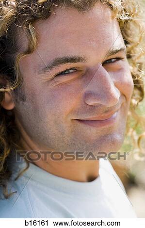 Detailed view of man smiling outdoors View Large Photo Image Stock Image - Detailed view of man smiling outdoors. Fotosearch