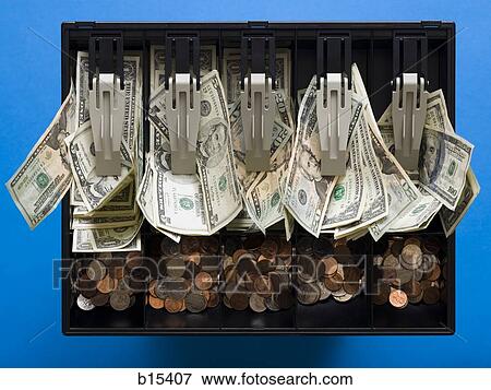 Detailed view of messy US currency and coins in till View Large Photo Image Stock Photo - Detailed view of messy US currency and coins in till. Fotosearch