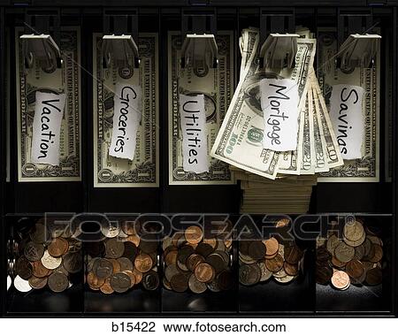 Detailed view of US currency and coins in till with labels for household expenses View Large Photo Image Stock Image - Detailed view of US currency and coins in till with labels for household expenses. Fotosearch