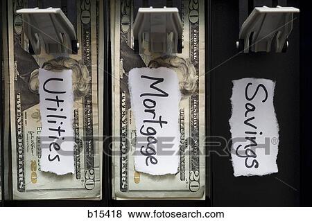 Detailed view of US currency in till with mortgage and utilities labels without savings View Large Photo Image Stock Photo - Detailed view of US currency in till with mortgage and utilities labels without savings. Fotosearch