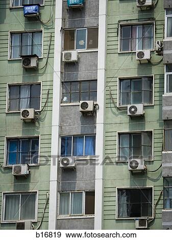 Detailed view of windows in apartment building with air conditioning units View Large Photo Image Stock Photo - Detailed view of windows in apartment building with air conditioning units. Fotosearch