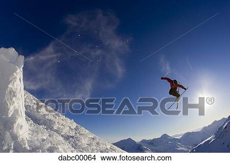Downhill ski jumper in air View Large Photo Image Picture - Downhill ski jumper in air. Fotosearch