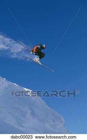 Downhill ski jumper in air View Large Photo Image Stock Image - Downhill ski jumper in air. Fotosearch