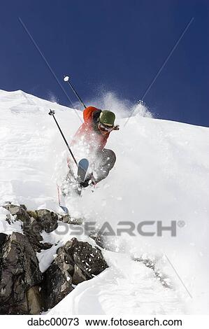 Downhill ski jumper in air View Large Photo Image Stock Image - Downhill ski jumper in air. Fotosearch