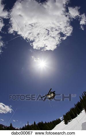 Downhill ski jumper in air View Large Photo Image Stock Photo - Downhill ski jumper in air. Fotosearch